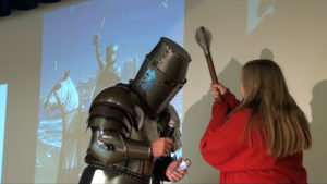 Girl hitting knight with mace